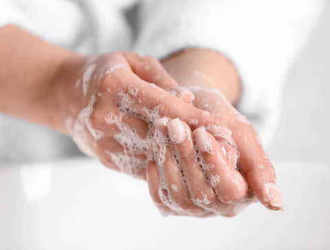 person washing their hands